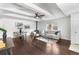 Bright living room with wood floors, beamed ceiling, and a cozy fireplace at 404 S Jasmine St, Denver, CO 80224