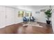 Bright living room showcasing hardwood floors, large windows, and modern décor, with cozy seating at 404 S Jasmine St, Denver, CO 80224