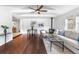 Open living area with hardwood floors, stylish furniture, and a cozy fireplace at 404 S Jasmine St, Denver, CO 80224