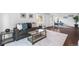 Comfortable living room featuring modern furnishings, hardwood floors, and bright, neutral decor and fixtures at 404 S Jasmine St, Denver, CO 80224