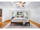 Spacious main bedroom featuring a large bed and an ensuite bathroom at 404 S Jasmine St, Denver, CO 80224