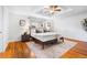 Inviting main bedroom with natural light, hardwood floors, and ceiling fan at 404 S Jasmine St, Denver, CO 80224