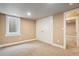 Basement bedroom features neutral carpet, a window, and a double door closet at 4293 Graham Ct, Boulder, CO 80305