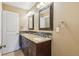 Bathroom with double vanity, granite countertops and framed mirrors at 4293 Graham Ct, Boulder, CO 80305