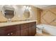 Well-lit bathroom with granite countertop, double sinks, and tiled shower/tub at 4293 Graham Ct, Boulder, CO 80305