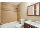 Tiled bathroom features a shower and tub combination with modern fixtures and a vanity at 4293 Graham Ct, Boulder, CO 80305