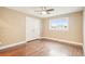 Bedroom features hardwood floors, ceiling fan, closet, and window for ample natural light at 4293 Graham Ct, Boulder, CO 80305