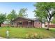 Beautiful brick home with a cozy front porch, mature landscaping, and charming curb appeal for a welcoming feel at 4293 Graham Ct, Boulder, CO 80305