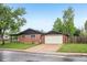 Charming brick home featuring a two-car garage, well-maintained lawn, and mature trees for curb appeal at 4293 Graham Ct, Boulder, CO 80305
