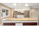 Modern kitchen with granite countertops, stainless appliances, and island with breakfast bar seating at 4293 Graham Ct, Boulder, CO 80305