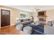 Inviting living room with hardwood floors, fireplace, and large window for natural light at 4293 Graham Ct, Boulder, CO 80305