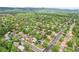 Expansive aerial view showcasing a vibrant, green neighborhood with tree-lined streets and diverse housing options at 4293 Graham Ct, Boulder, CO 80305