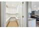 Walk-in pantry with bright lighting and ample shelving for maximum storage at 4293 Graham Ct, Boulder, CO 80305