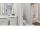 Bright bathroom featuring modern fixtures, a single vanity, and a shower-tub combo at 7173 S Shady Grove Ct, Aurora, CO 80016