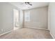 Cozy bedroom with neutral walls and carpet at 7173 S Shady Grove Ct, Aurora, CO 80016