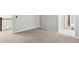 Cozy bonus room featuring neutral walls and carpet at 7173 S Shady Grove Ct, Aurora, CO 80016
