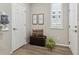 Cozy entryway with storage bench, decorative pillows, and stylish 'home' artwork at 7173 S Shady Grove Ct, Aurora, CO 80016