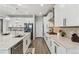 This kitchen features stainless appliances, island with granite countertops, and ample counter space at 7173 S Shady Grove Ct, Aurora, CO 80016