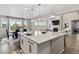Kitchen with island flowing to dining room and living room and fireplace at 7173 S Shady Grove Ct, Aurora, CO 80016