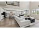 Stylish living area open to a modern kitchen with stainless steel appliances and a dining area nearby at 7173 S Shady Grove Ct, Aurora, CO 80016
