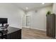 Cozy office space with dark wood desk and a view of outdoors through the window at 7173 S Shady Grove Ct, Aurora, CO 80016