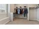 Spacious walk-in closet with custom shelving and ample storage space, providing organized wardrobe solutions at 7173 S Shady Grove Ct, Aurora, CO 80016