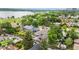 Aerial view of the property showcasing the home's layout, surrounding greenery, lake and neighborhood at 1655 Yates St, Denver, CO 80204
