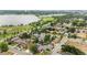 A neighborhood near a serene lake boasts mature trees, well-maintained houses, and a beautiful lakeside path at 1655 Yates St, Denver, CO 80204