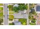 The home features a well-maintained roof and an expansive backyard deck and is adjacent to well-kept lawns and landscaping at 1655 Yates St, Denver, CO 80204