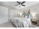 Bright bedroom featuring a ceiling fan, stylish decor, and closet for ample storage at 1655 Yates St, Denver, CO 80204