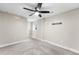 Bedroom with ceiling fan, neutral carpet and walls plus a wall mount for television at 1655 Yates St, Denver, CO 80204