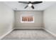 Bedroom featuring a ceiling fan, neutral walls, carpet, and natural light from a window at 1655 Yates St, Denver, CO 80204