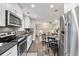 Modern kitchen with stainless steel appliances, sleek countertops, and ample cabinet space at 1655 Yates St, Denver, CO 80204