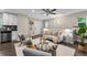 Cozy open-concept living room and kitchen, featuring hardwood floors and lots of natural light at 1655 Yates St, Denver, CO 80204