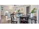 Open concept living room and dining area with stylish furnishings, hardwood floors, and natural lighting at 1655 Yates St, Denver, CO 80204