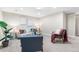 Comfortable living room boasts neutral tones and a well-lit ambiance at 1655 Yates St, Denver, CO 80204