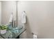 Chic powder room featuring a vessel sink, modern fixtures, and a decorative mirror at 1655 Yates St, Denver, CO 80204