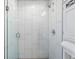 Contemporary bathroom with an all-white glass enclosed walk-in shower and modern fixtures at 1655 Yates St, Denver, CO 80204