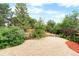 Fenced backyard with rock garden, mulch and pea gravel at 4257 S Andes Way, Aurora, CO 80013