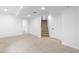 Finished basement includes neutral carpet and stairs to main level at 4257 S Andes Way, Aurora, CO 80013