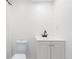 Clean bathroom featuring a white vanity and toilet at 4257 S Andes Way, Aurora, CO 80013