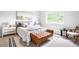 Comfortable bedroom with neutral colors, a bench at the foot of the bed and natural light at 4257 S Andes Way, Aurora, CO 80013
