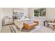 Cozy bedroom featuring a comfortable bed, stylish decor, and a window view of lush greenery at 4257 S Andes Way, Aurora, CO 80013
