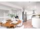 Open concept dining area flowing from the kitchen and featuring contemporary furnishings at 4257 S Andes Way, Aurora, CO 80013
