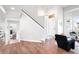 Spacious foyer with hardwood floors, staircase and a view to the living room at 4257 S Andes Way, Aurora, CO 80013