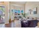 Inviting living room with large windows, stylish decor, and a cozy seating arrangement at 4257 S Andes Way, Aurora, CO 80013