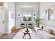 Inviting living room with large windows, stylish furniture, and modern decor at 4257 S Andes Way, Aurora, CO 80013