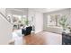 Spacious living area with hardwood floors, large windows, and stylish, contemporary decor at 4257 S Andes Way, Aurora, CO 80013