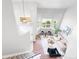 Bright, open-concept living room, as viewed from the stairway landing, with modern decor at 4257 S Andes Way, Aurora, CO 80013