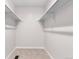 A walk-in closet features carpet flooring and shelving at 4257 S Andes Way, Aurora, CO 80013